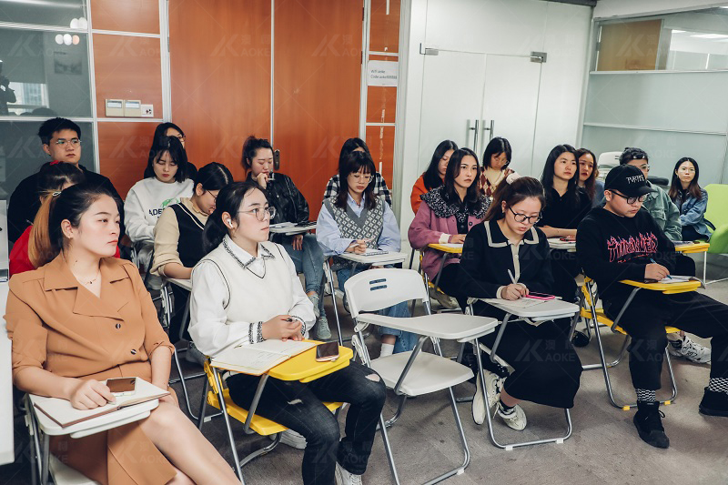 Aoke employees listen carefully to product quality control standards